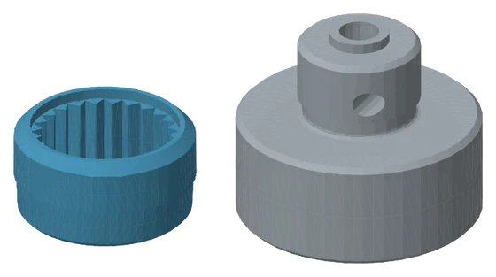 Render of two unassembled parts side by side on an empty ground: a blue ring with a ridged inner wall on the left, a grey round base with a raised hub on the right.