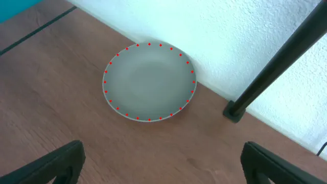 Wrist-camera view of a bowl with an ellipse drawn along its rim.