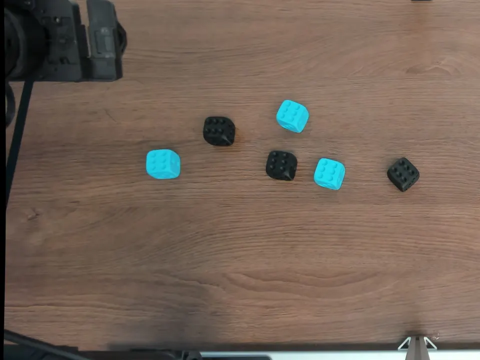 Overhead photograph of six dice all showing six pips upward.